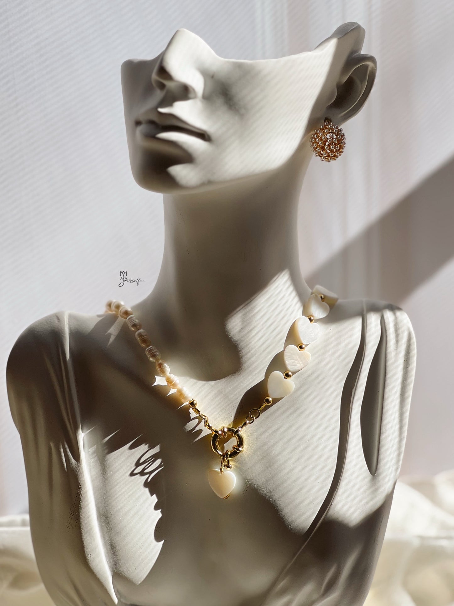 Set de perlas y corazón